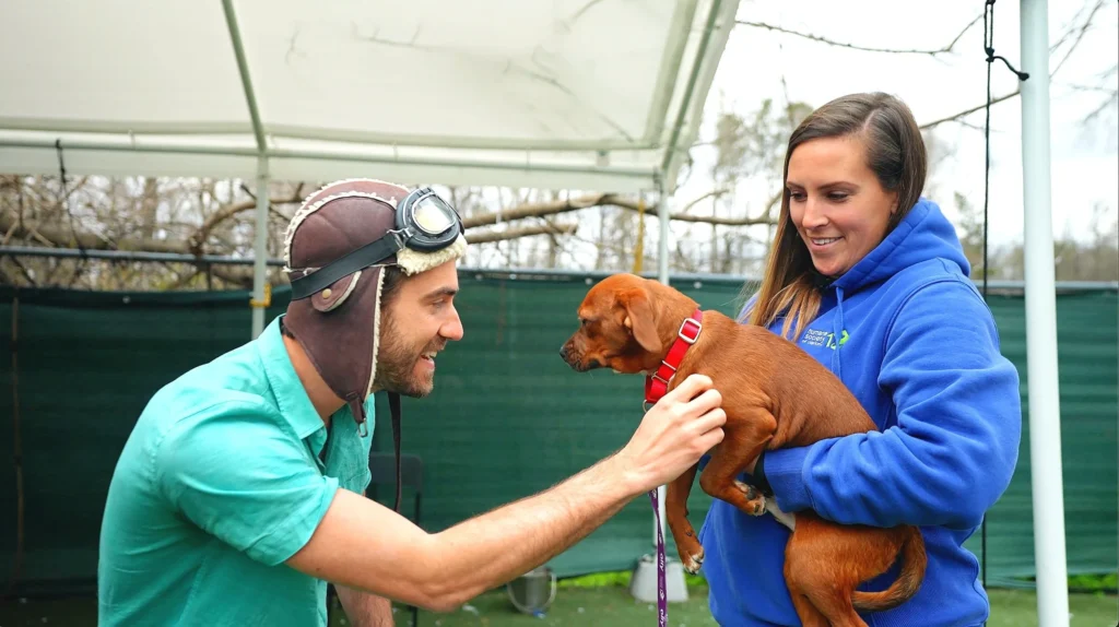 danny Go with dog at shelter
